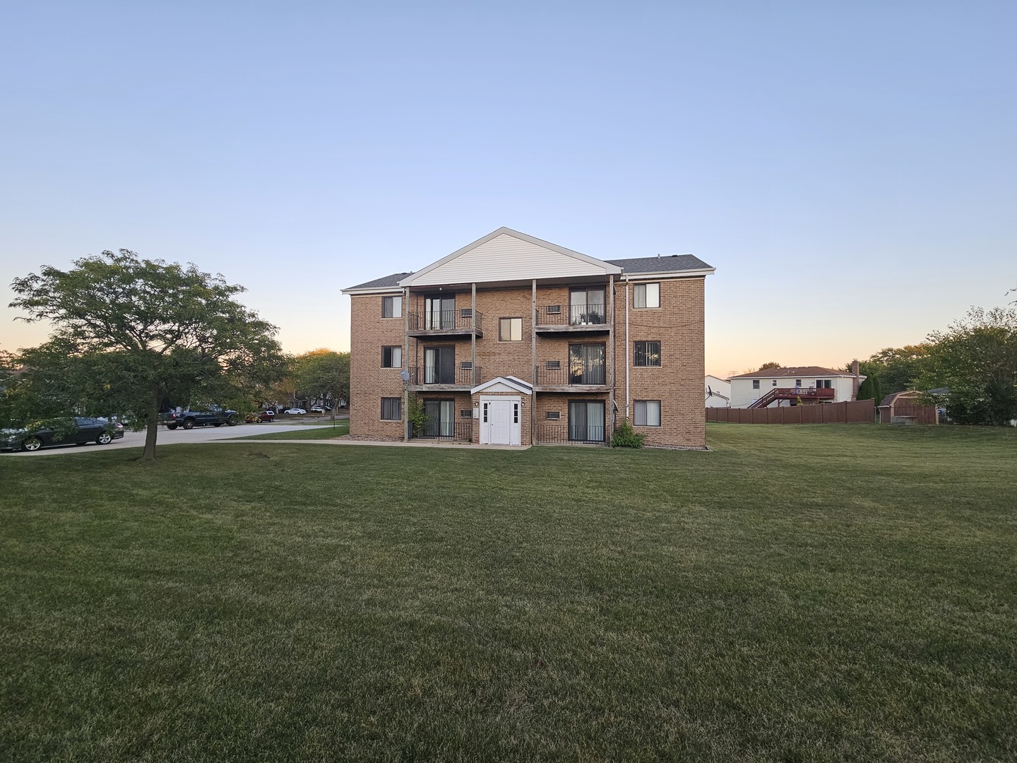 737 Lippert Lane, Unit 2N Glendale Heights, IL 60139 - Photo 1 of 15 a view of a big house with a big yard