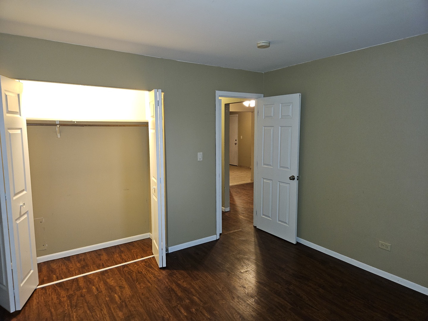 737 Lippert Lane, Unit 2N Glendale Heights, IL 60139 - Photo 11 of 15 an empty room with wooden floor and closet