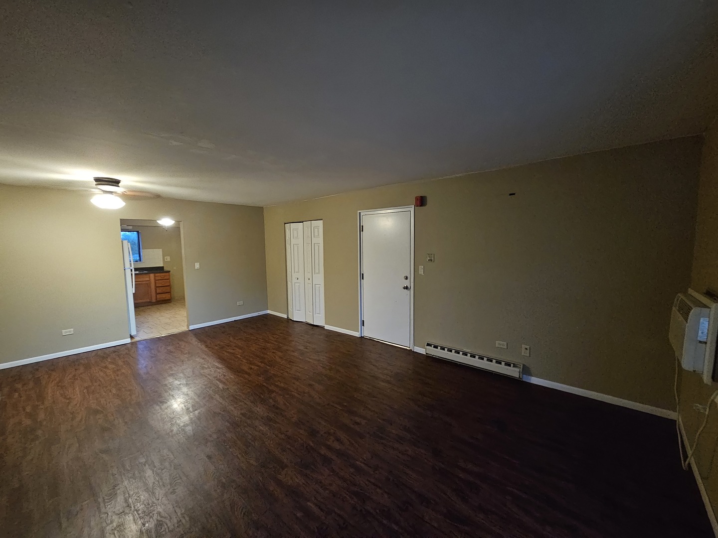 737 Lippert Lane, Unit 2N Glendale Heights, IL 60139 - Photo 9 of 15 a view of an empty room with wooden floor