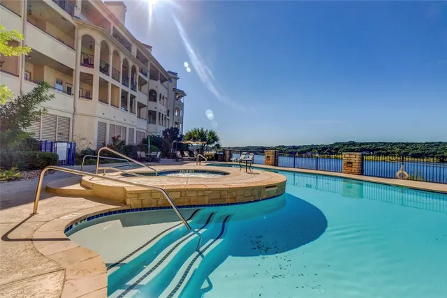 a swimming pool with chairs