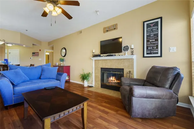 a living room with furniture and a fireplace
