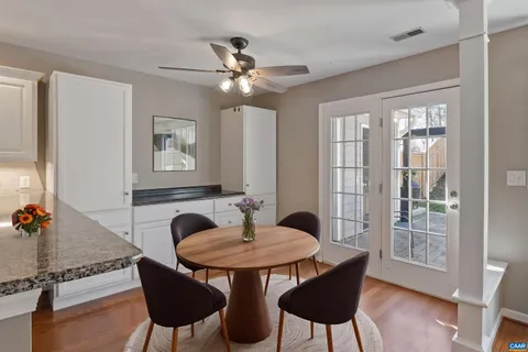 a dining room with furniture and window