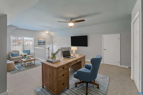 a view of a workspace with furniture
