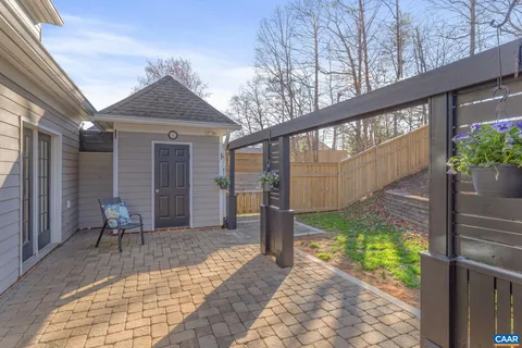 a view of house with backyard outdoor seating and plants