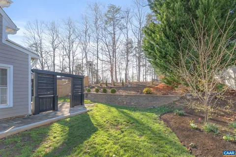 a view of a back yard with a patio