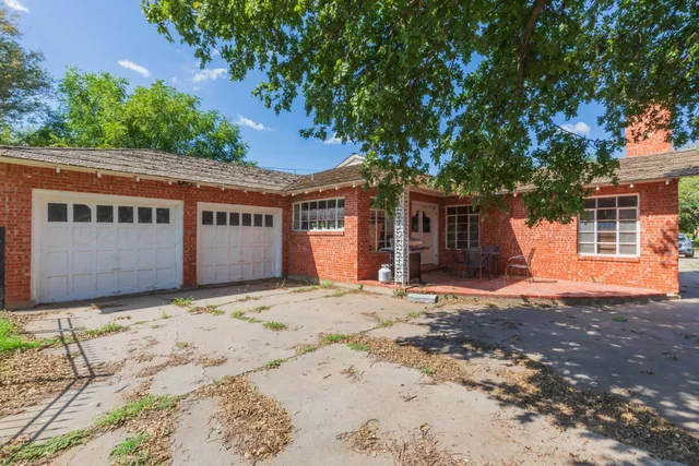 a house with a tree in front of it