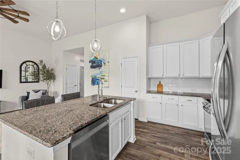 a kitchen with sink and cabinets