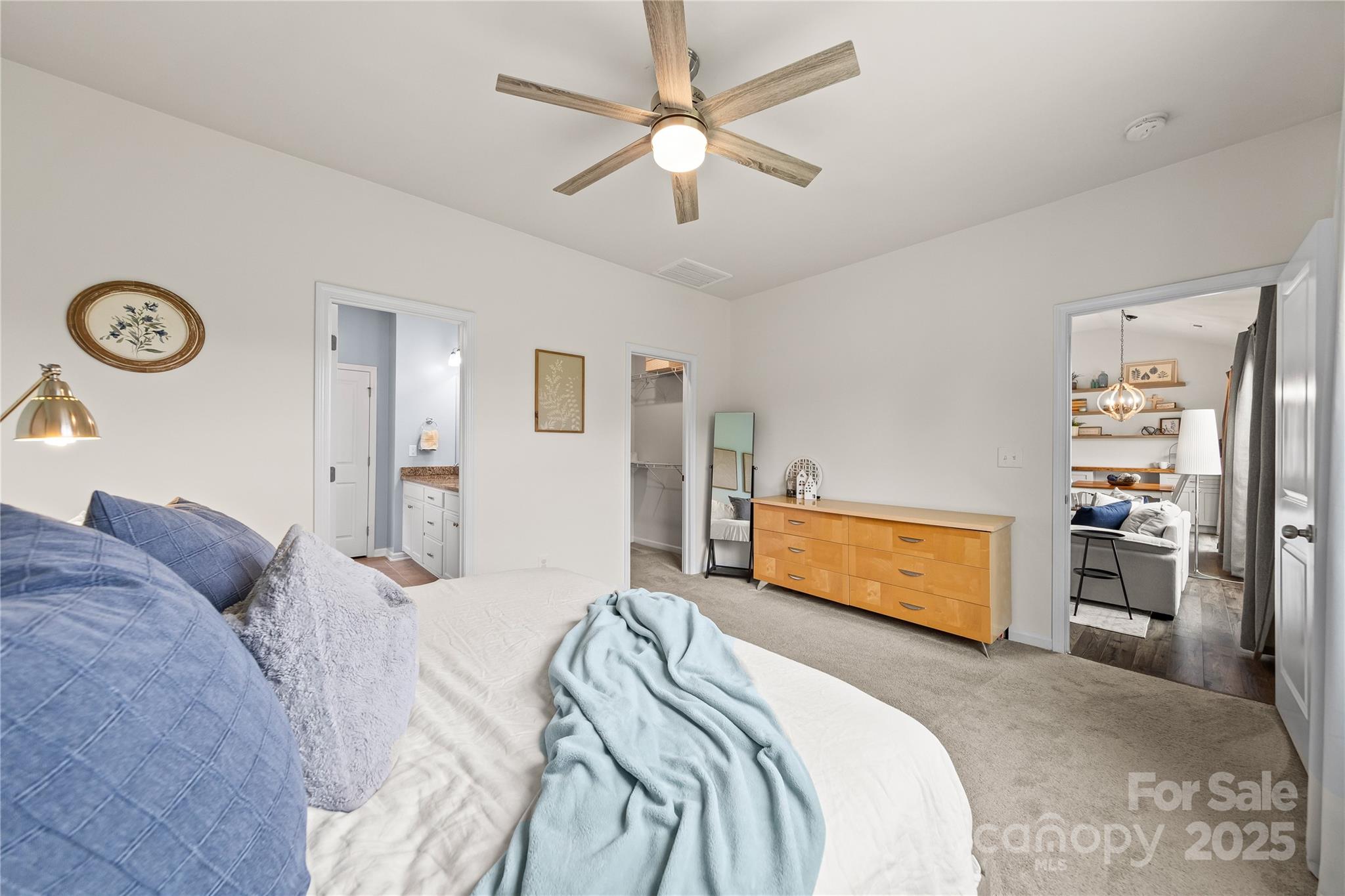 4515 Dover Court Denver, NC 28037 - Photo 19 of 41 a bedroom with a bed and a chandelier