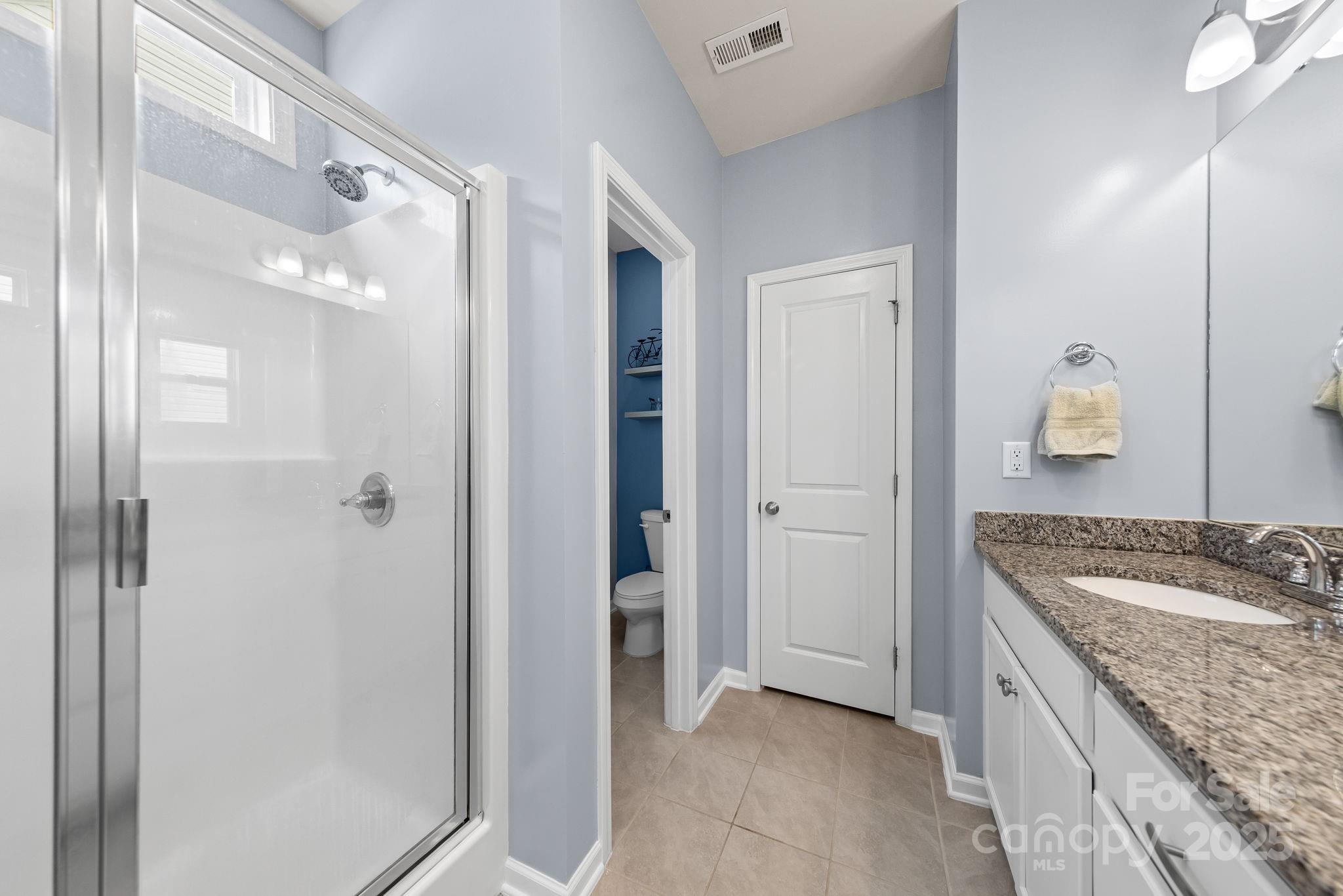 4515 Dover Court Denver, NC 28037 - Photo 22 of 41 a bathroom with a granite countertop sink and a mirror