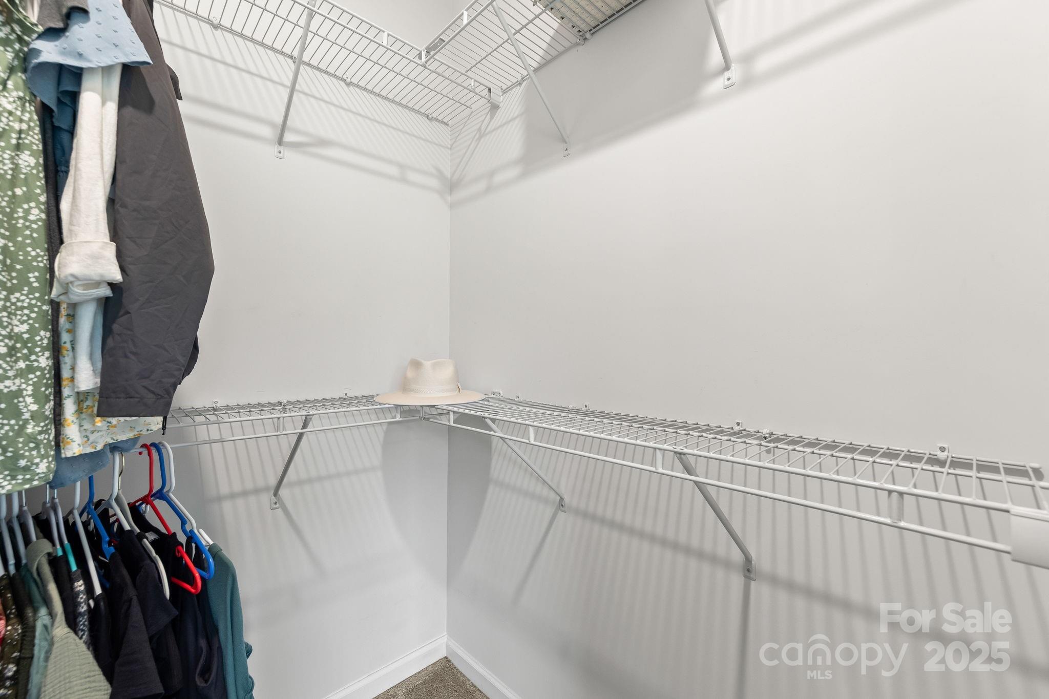 4515 Dover Court Denver, NC 28037 - Photo 23 of 41 a view of walk in closet with clothes and shoes