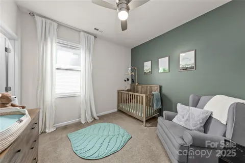 a bedroom with furniture and a window