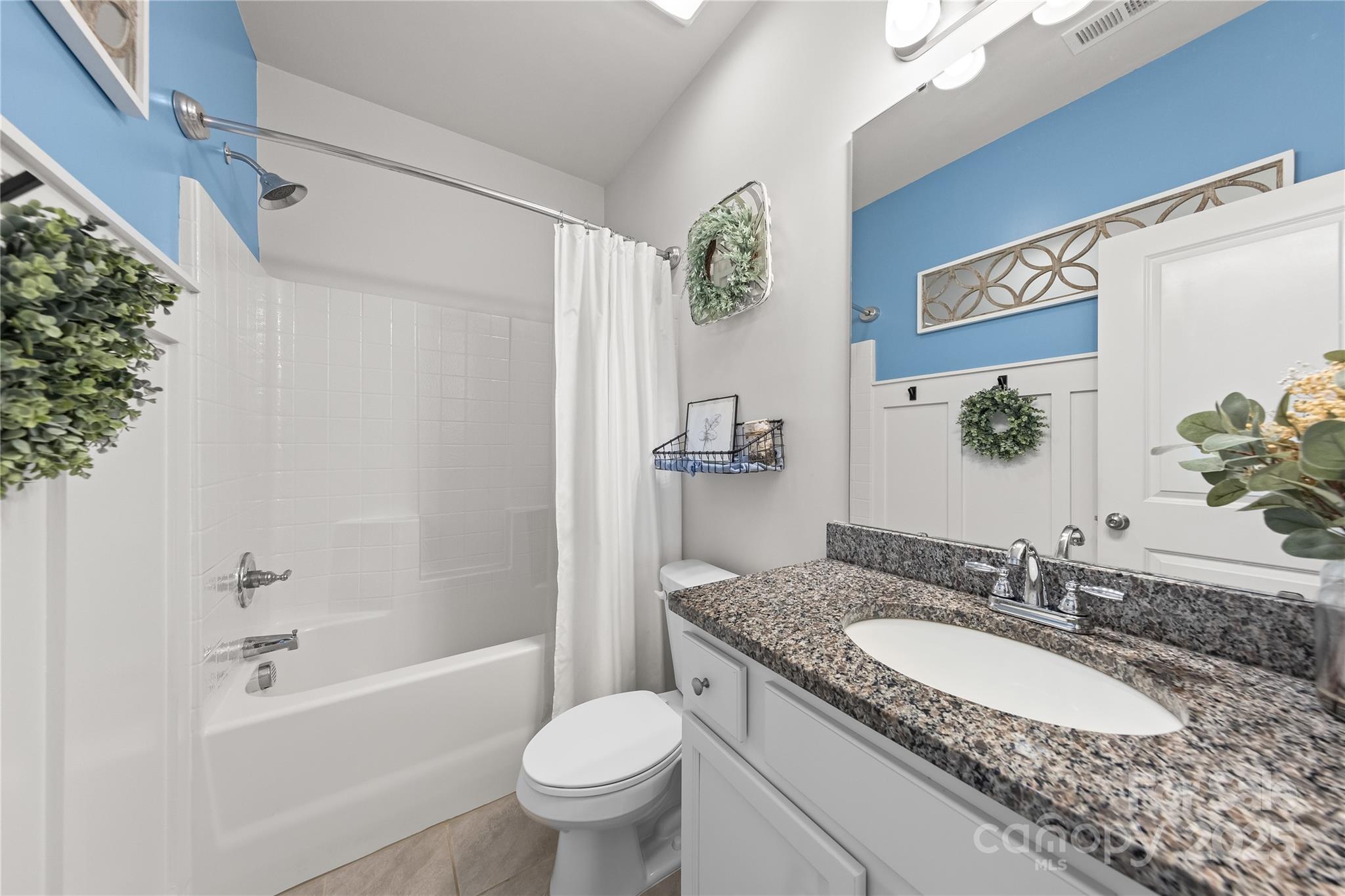 4515 Dover Court Denver, NC 28037 - Photo 26 of 41 a bathroom with a granite countertop sink toilet and shower