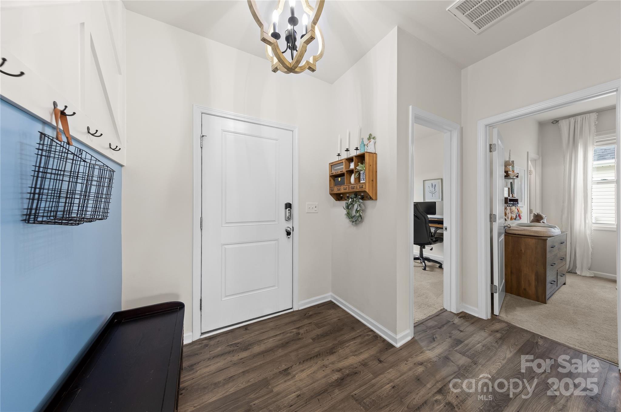 4515 Dover Court Denver, NC 28037 - Photo 27 of 41 a view of a hallway with wooden floor and a living room