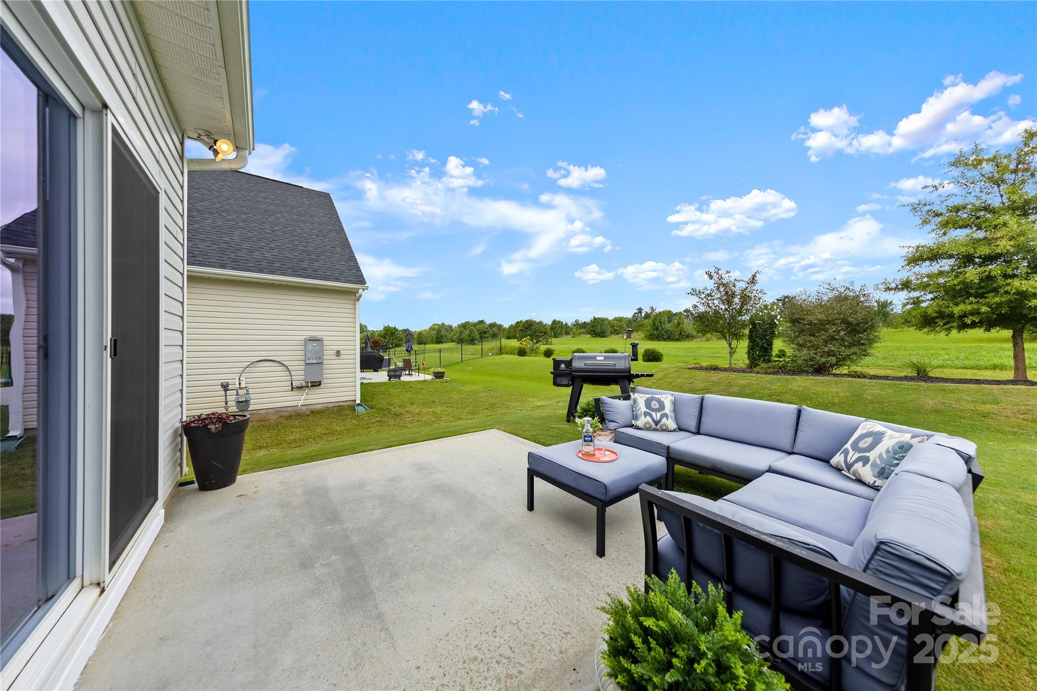 4515 Dover Court Denver, NC 28037 - Photo 30 of 41 a view of a patio with couches chairs and a table and chairs