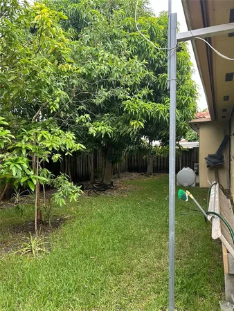 a backyard of a house with lots of green space