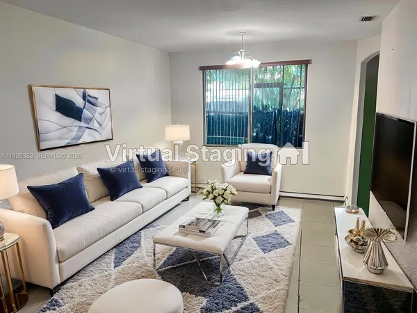 a living room with furniture a large window and a flat screen tv