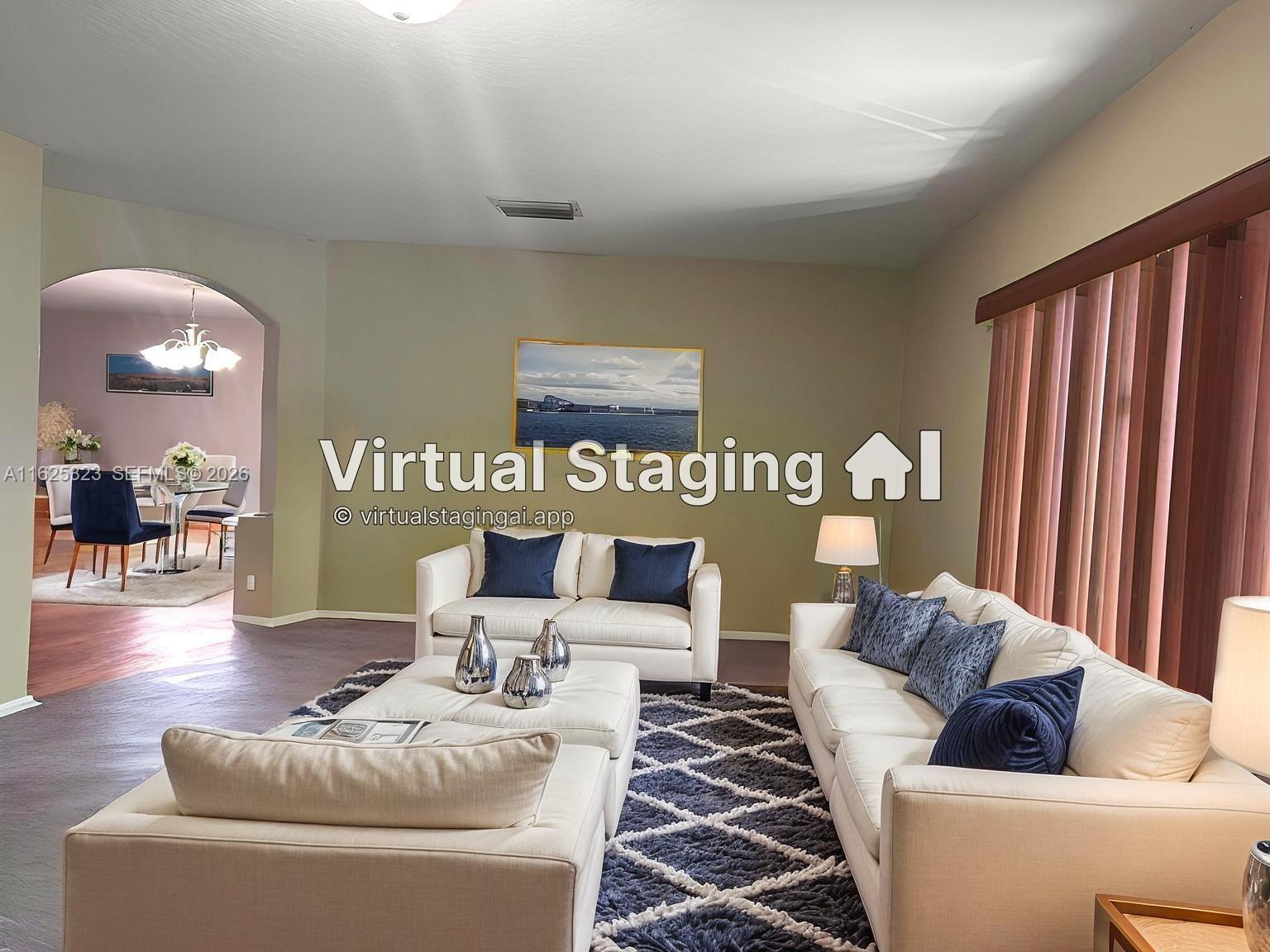 12414 Southwest 213th Street Miami, FL 33177 - Photo 3 of 15 a living room with furniture and a large mirror