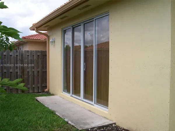 a view of a backyard of the house