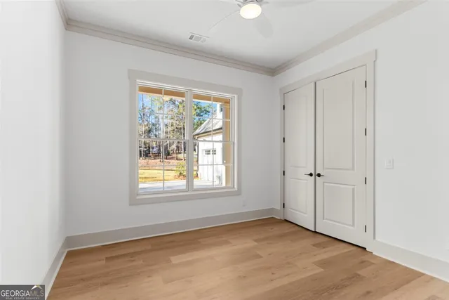 a front view of a house with a yard outdoor seating and garage