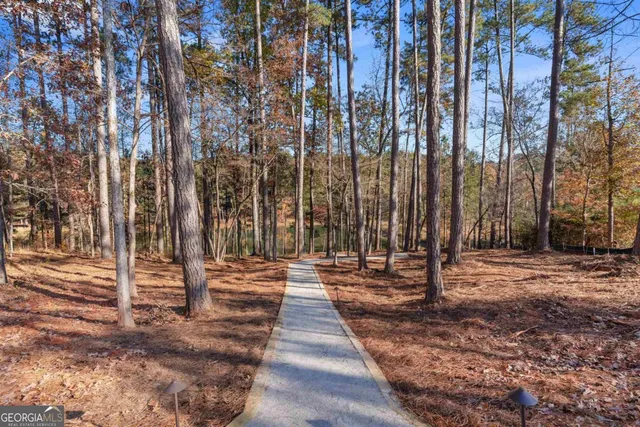 a kitchen with a sink stainless steel appliances and cabinets