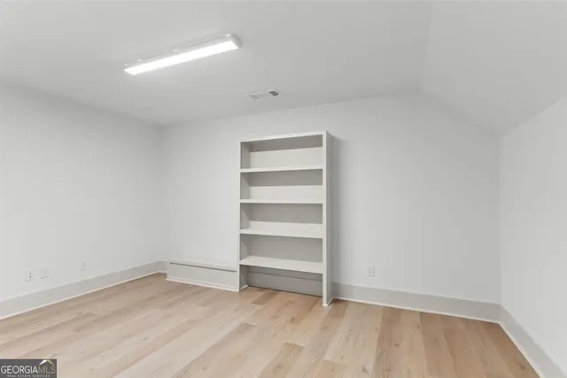 an aerial view of a house with a garden