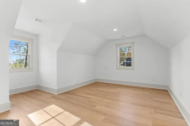 a view of a lake in middle of forest