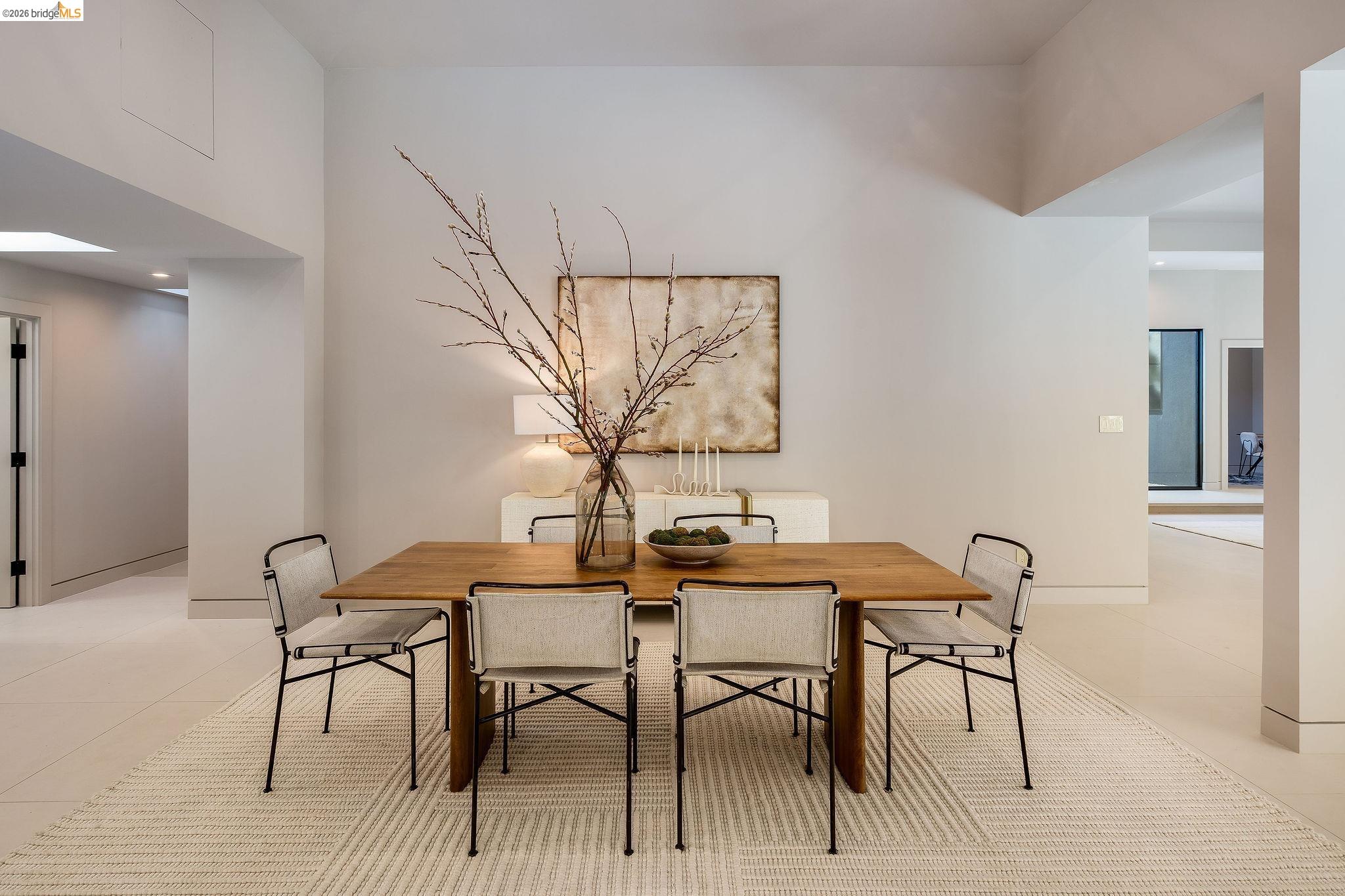 5645 Bacon Road Oakland, CA 94619 - Photo 23 of 94 Spacious dining area featuring a light wood-finish table, recessed lighting, high ceilings, light-toned flooring, and a skylight providing natural illumination