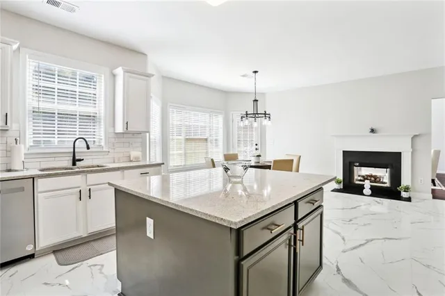 a kitchen with a stove a sink and a refrigerator
