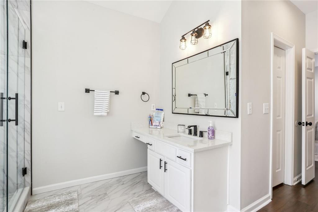 5161 Madison Green Drive Southwest Mableton, GA 30126 - Photo 25 of 40 a bathroom with a sink vanity and a mirror