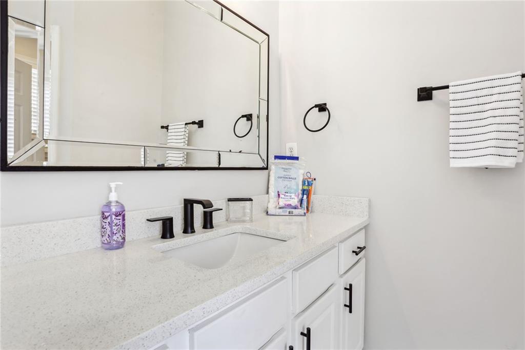5161 Madison Green Drive Southwest Mableton, GA 30126 - Photo 28 of 40 a bathroom with a sink and a mirror