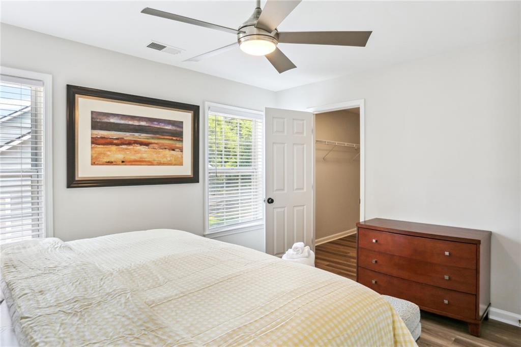 5161 Madison Green Drive Southwest Mableton, GA 30126 - Photo 31 of 40 a bedroom with a bed and a painting on the wall