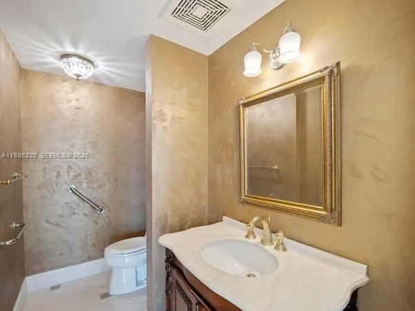 a view of a dining area with furniture and chandelier