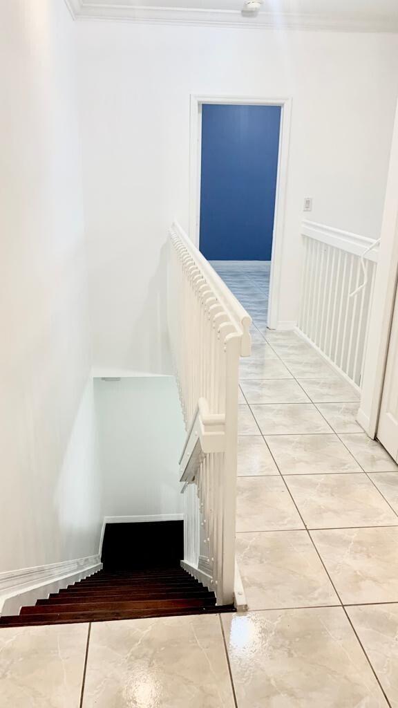 15809 Southwest 60th Terrace Miami, FL 33193 - Photo 15 of 20 a view of staircase with white walls