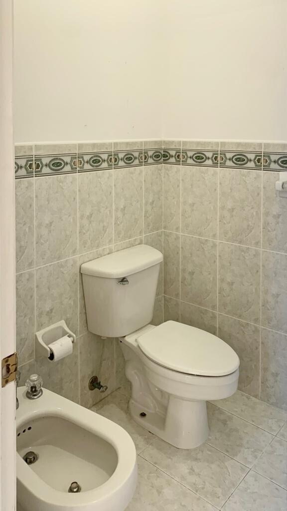 15809 Southwest 60th Terrace Miami, FL 33193 - Photo 16 of 20 a bathroom with a toilet a sink and mirror