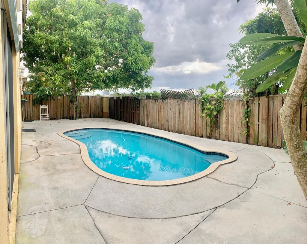 15809 Southwest 60th Terrace Miami, FL 33193 - Photo 18 of 20 a view of a backyard with swimming pool