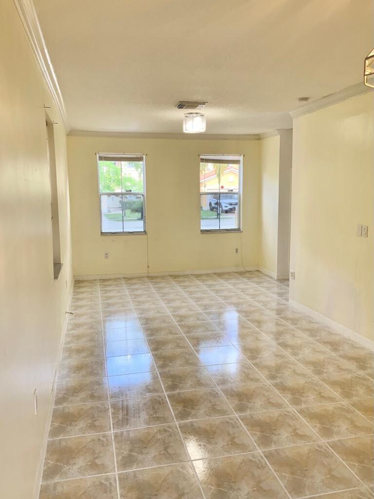 15809 Southwest 60th Terrace Miami, FL 33193 - Photo 4 of 20 a view of an empty room and window