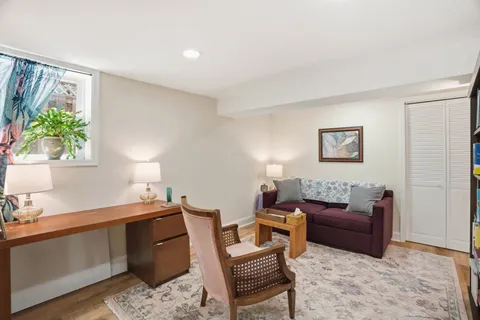 a living room with furniture and a window