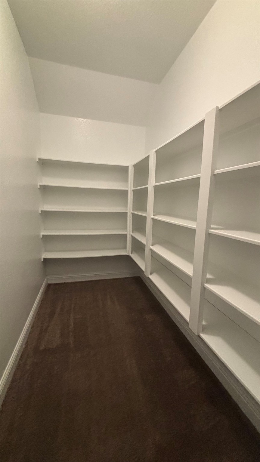 14915 Gyrfalcon Fork Cypress, TX 77429 - Photo 20 of 24 Spacious upstairs closet with ample shelving for all your storage needs.