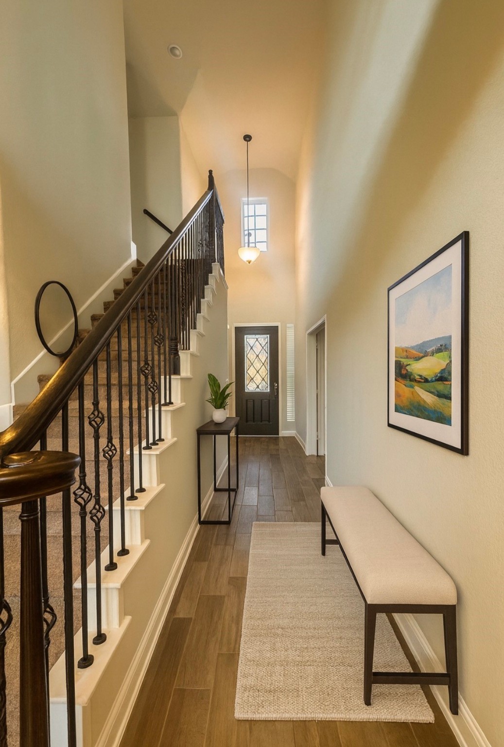 14915 Gyrfalcon Fork Cypress, TX 77429 - Photo 3 of 24 Welcoming entryway with high ceilings, elegant lighting, and a stylish staircase that sets the tone for the rest of the home.Virtually staged