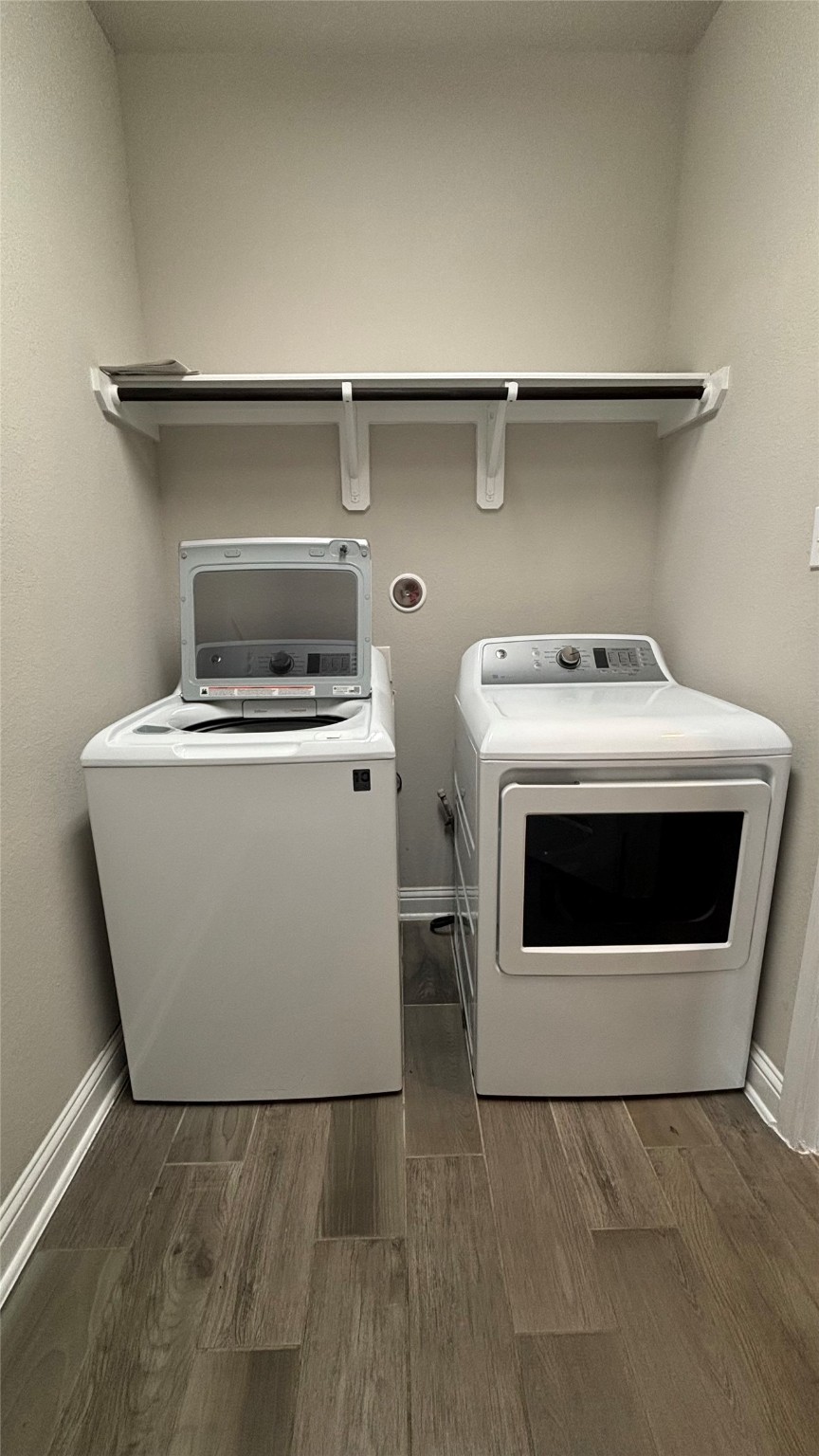 14915 Gyrfalcon Fork Cypress, TX 77429 - Photo 9 of 24 Efficient laundry room featuring included washer and dryer for your convenience.