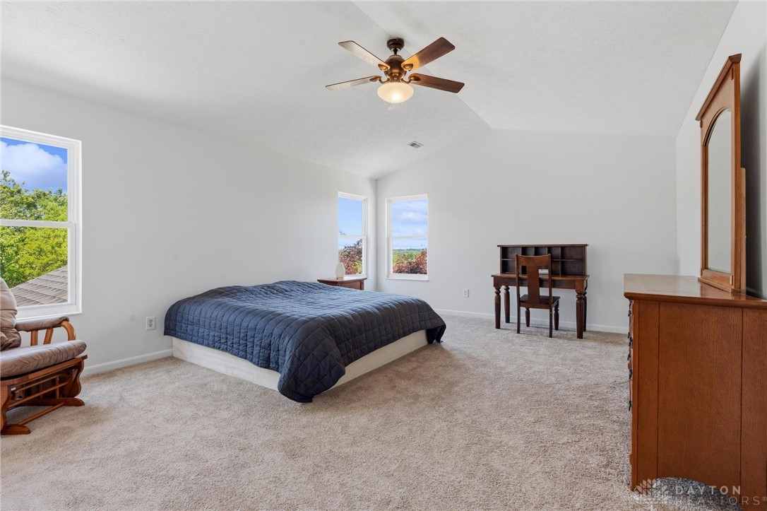 70 Martin Lane Springboro, OH 45066 - Photo 36 of 69 Bright and airy bedroom with vaulted ceilings and large windows, offering expansive views.