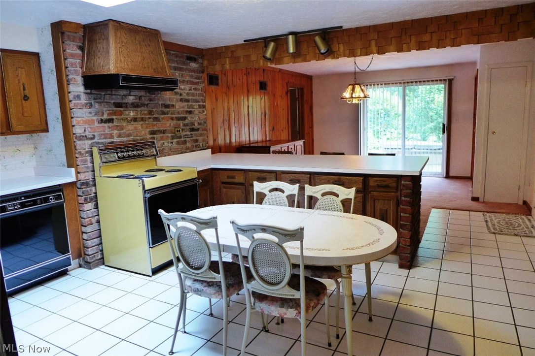 9645 Hoose Road Mentor, OH 44060 - Photo 8 of 21 Kitchen view into Dining Room and Slider to Side Porch area. Door on back left goes to Family Room and Master Bedroom/Bath/Sauna area.