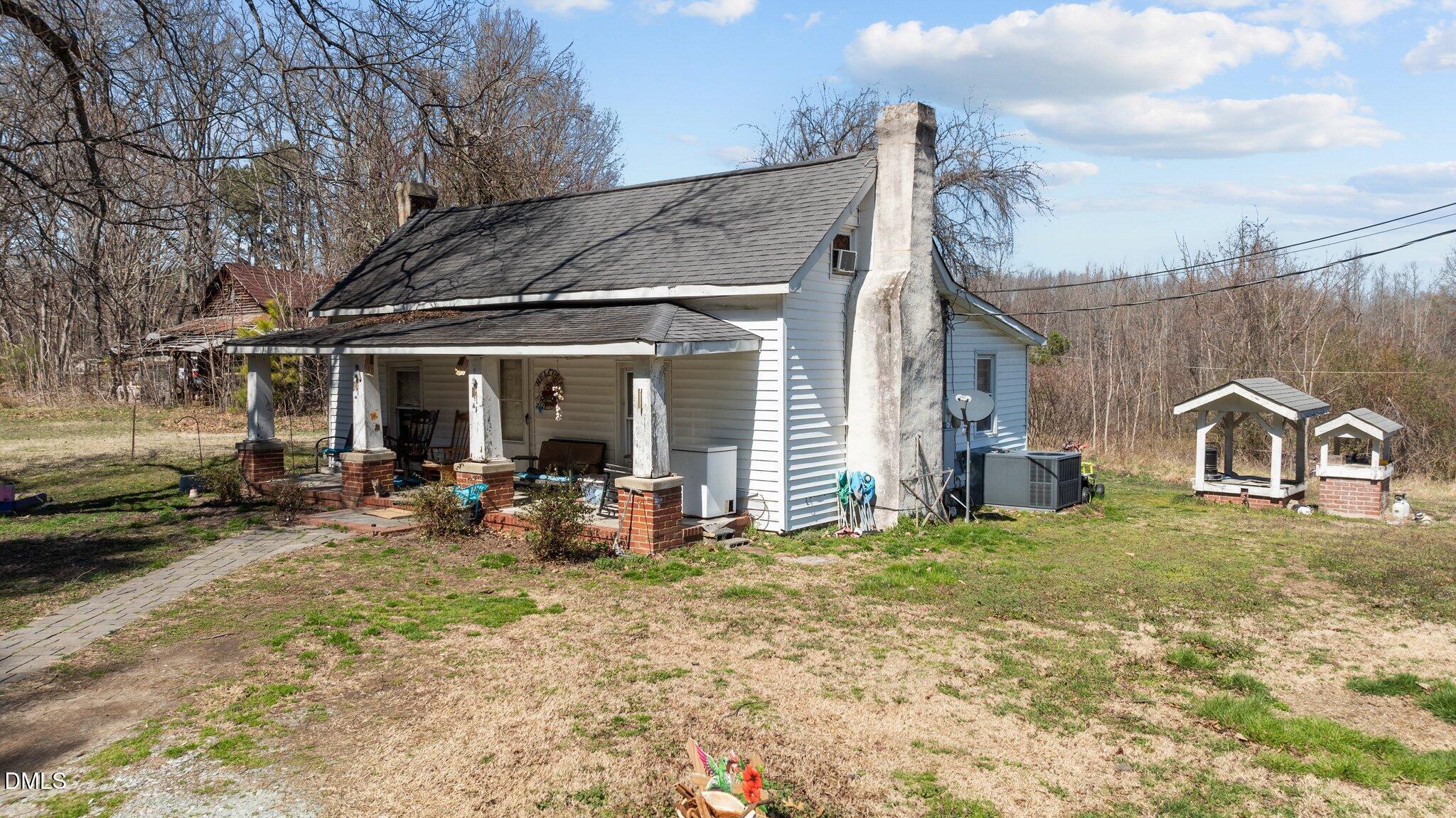 2710 Morton-Pulliam Road Roxboro, NC 27574 - Photo 3 of 13 a view of a house with backyard porch and furniture