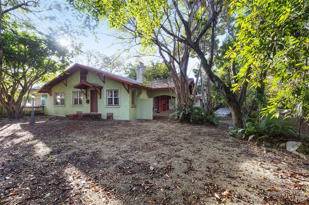 58 Northeast 48th Street Miami, FL 33137 - Photo 4 of 9 a view of a house with a yard and large tree