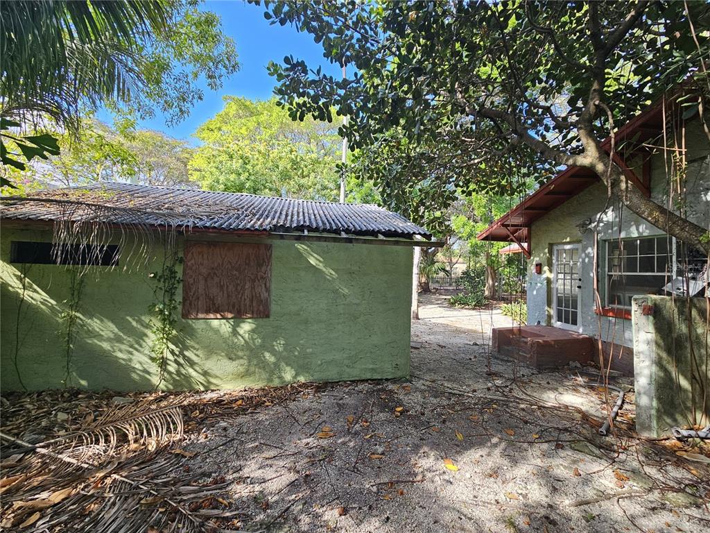 58 Northeast 48th Street Miami, FL 33137 - Photo 8 of 9 a view of a small house with a garden