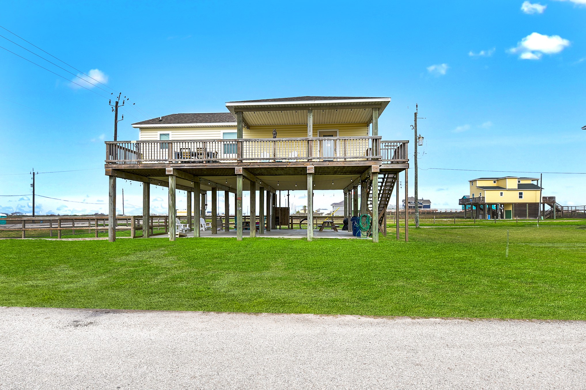 126 Nesmith Place Surfside Beach, TX 77541 - Photo 1 of 48 a front view of a house with a garden