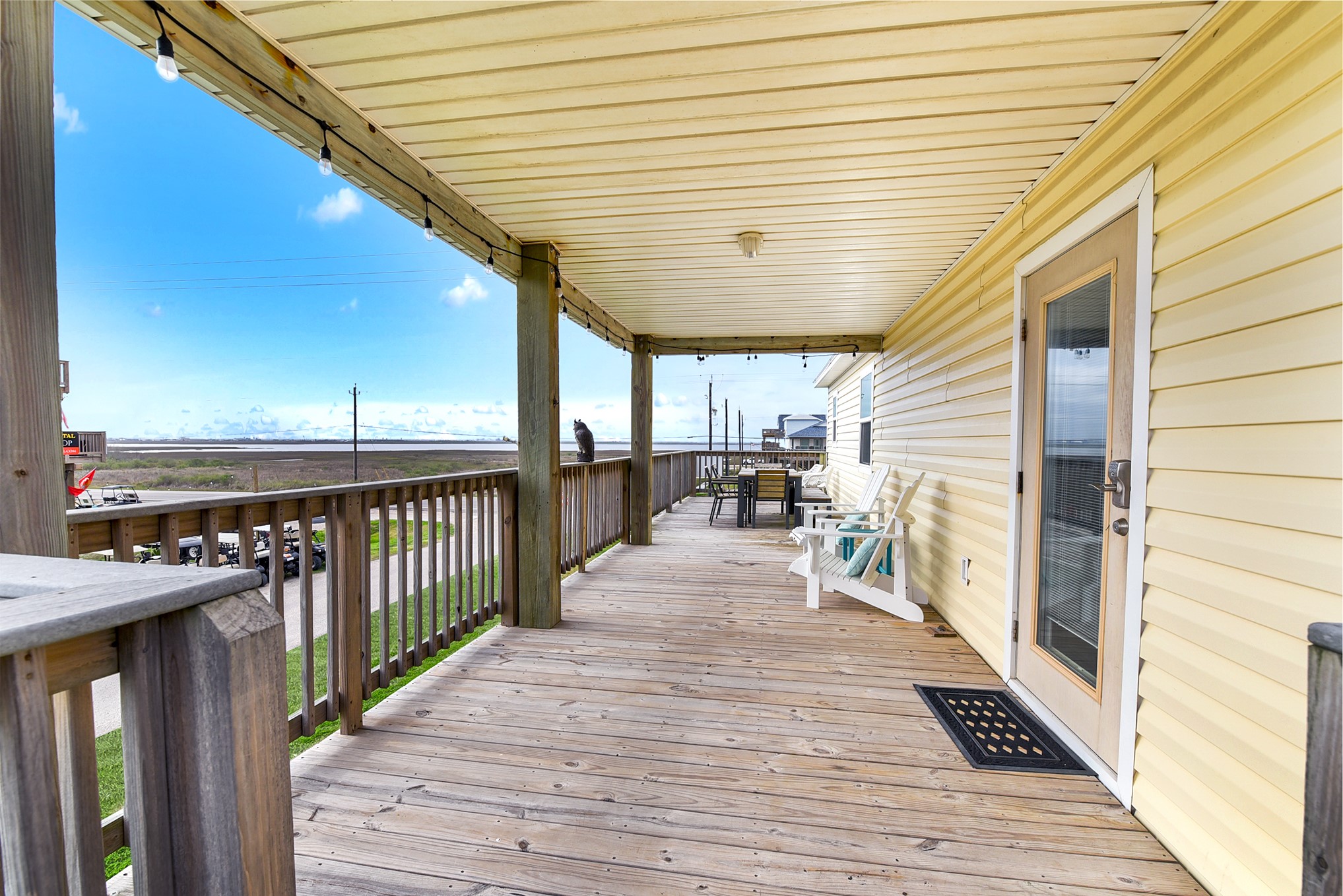 126 Nesmith Place Surfside Beach, TX 77541 - Photo 16 of 48 a view of a porch with wooden floor