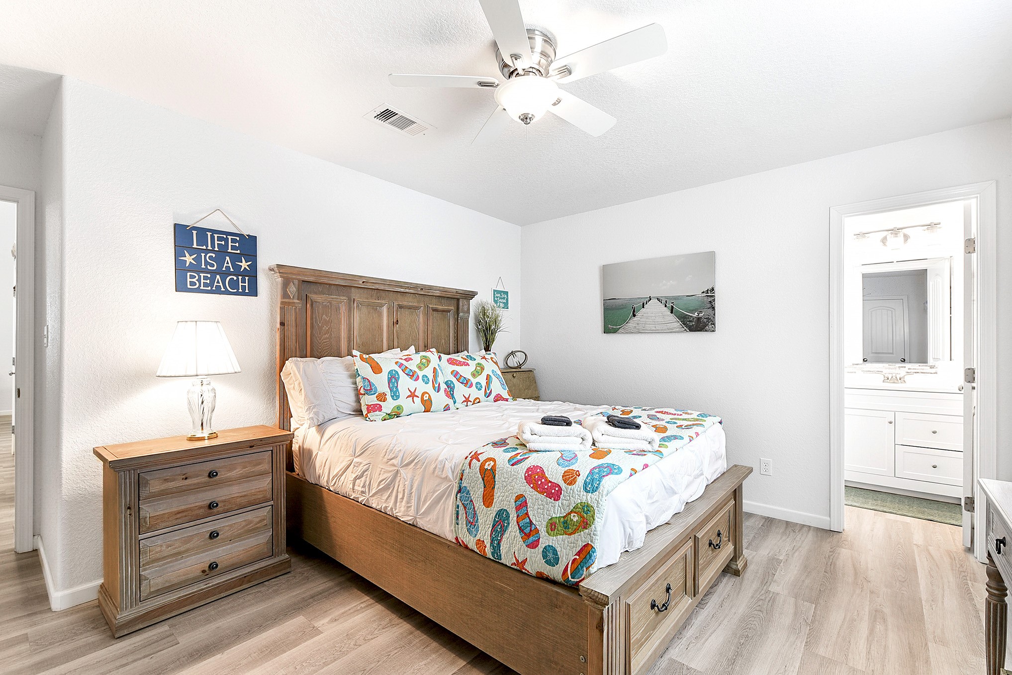 126 Nesmith Place Surfside Beach, TX 77541 - Photo 33 of 48 a bedroom with a bed and a dresser in it