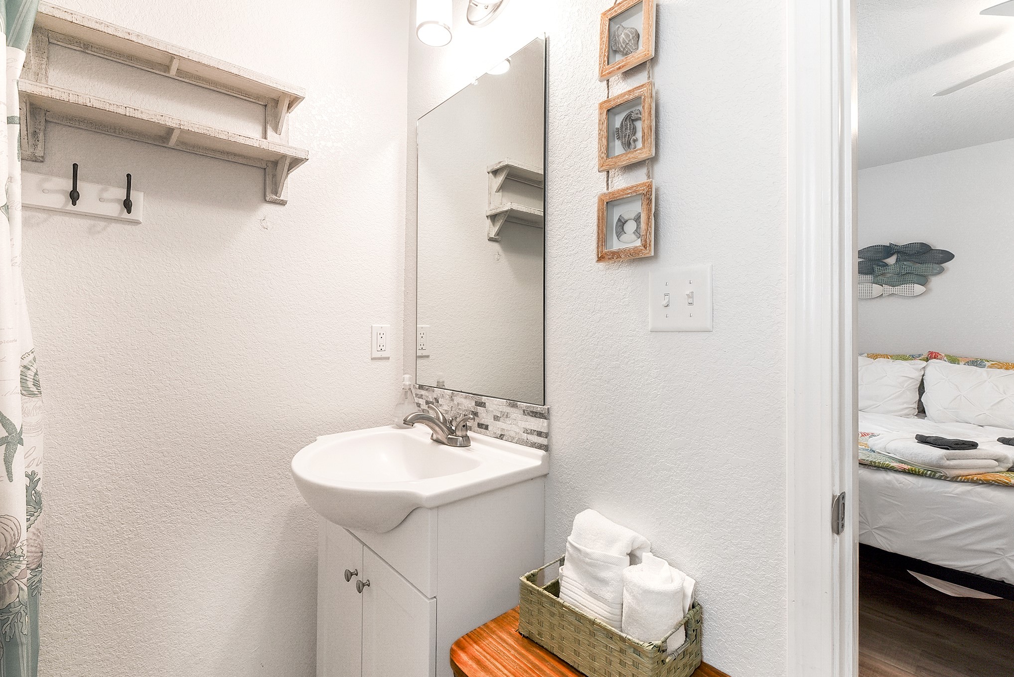 126 Nesmith Place Surfside Beach, TX 77541 - Photo 37 of 48 a bathroom with a sink and a mirror