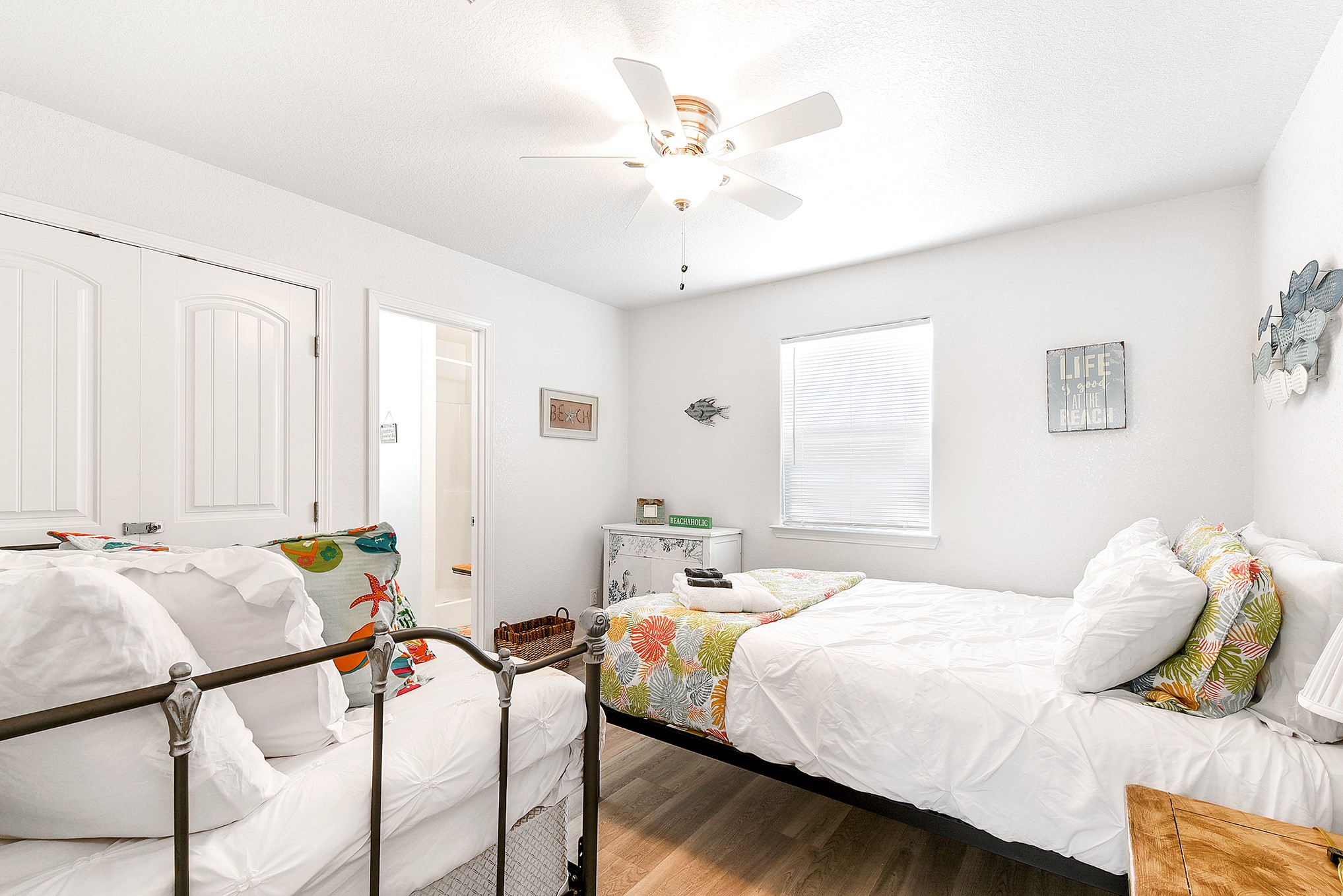 126 Nesmith Place Surfside Beach, TX 77541 - Photo 39 of 48 a bedroom with bed and a chandelier